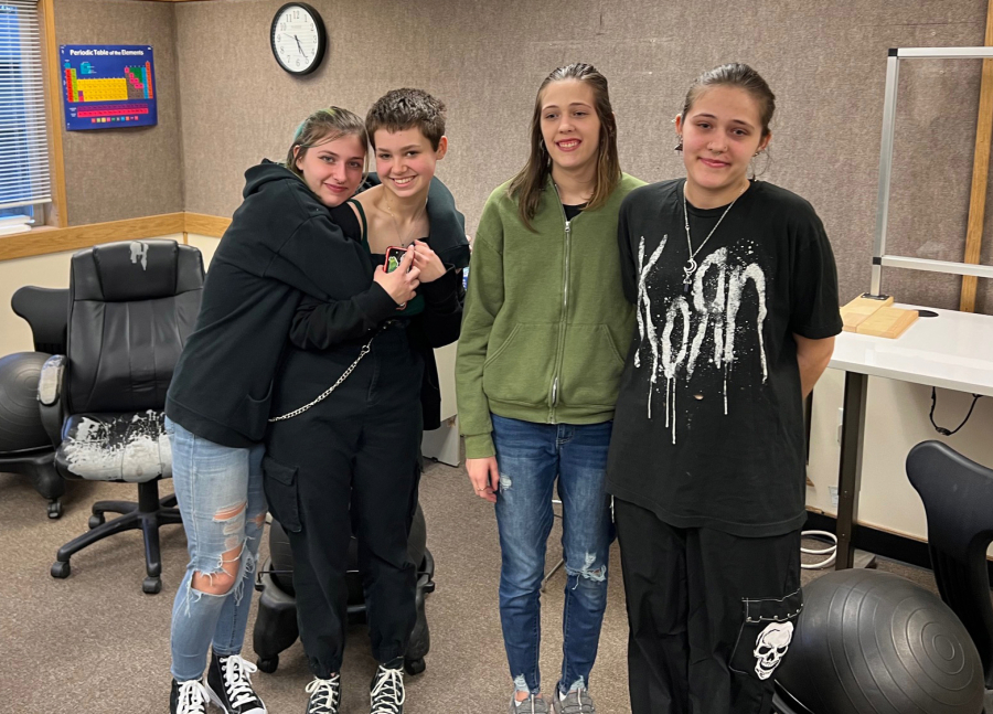 Lue Morgan (pictured on the far right) a senior at Woodland Public Schools' alternative TEAM High School, recently organized a poetry slam as a way for them and their classmates to have an opportunity to share their creativity and to have their voices heard.