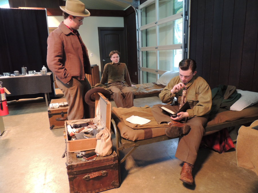 From left to right: Volunteers Rory Jensen, Dexter Abernathy and Alex Sample reenact the conditions experienced by members of the Civilian Conservation Corps at the Vancouver Barracks during a CCC 90th anniversary event Saturday at Fort Vancouver.