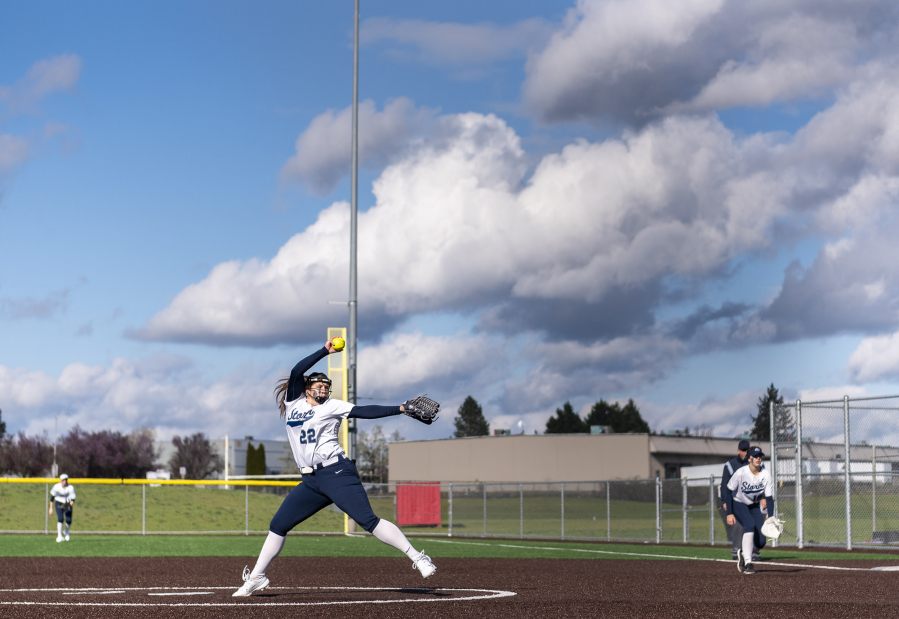 Clouds hang overhead as Skyview sophomore Maddie Milhorn pitches the ball Wednesday, April 12, 2023, during the Storm's 4-0 win against Battle Ground at Fort Vancouver High School.