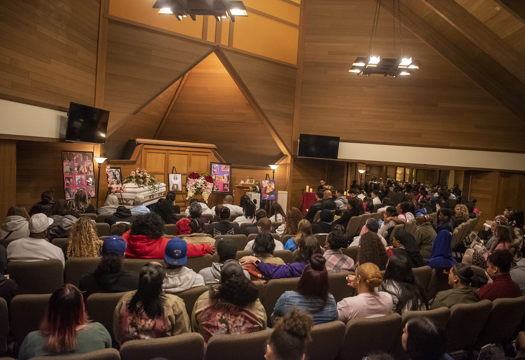 People fill an Evergreen Memorial Gardens chapel on Wednesday, April 19, 2023, for the funeral for Meshay Melendez and Layla Stewart.