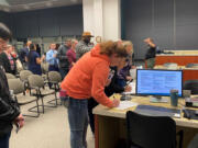 Vancouver resident Kylie Diaz signs up for public safety testing at Wednesday evening’s corrections open house hosted by the Clark County Jail Services Department. Diaz was one of about 15 women at the open house.