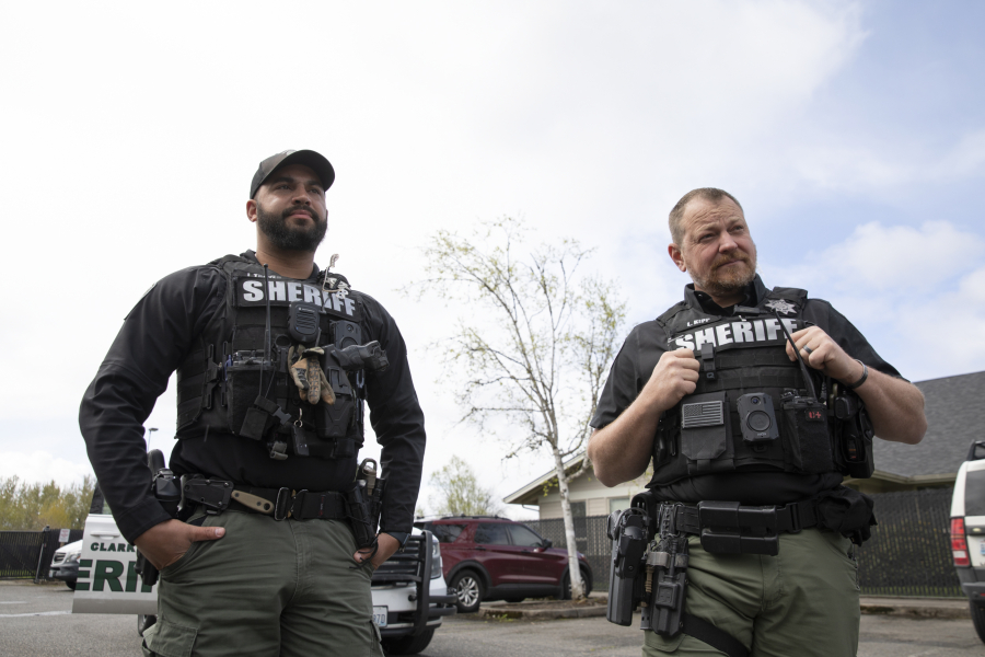 Deputies Josh Troyer, left, and Lanny Kipp wear Axon body-worn cameras on their vests Monday at the Clark County Sheriff's Office West Precinct in Ridgefield. They are participating in a 30-day test period for the body and vehicle cameras.