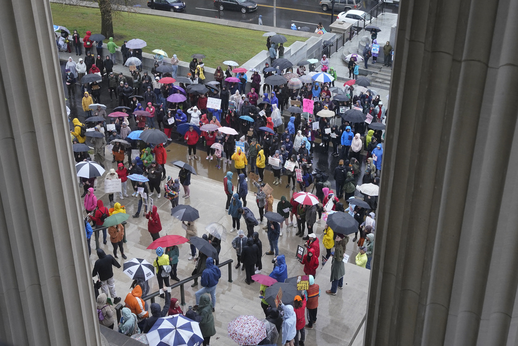 Protesters gather outside the state Capitol Thursday, April 6, 2023, in Nashville, Tenn., to demand gun law reform and to support three House Democrats up for expulsion for using a bullhorn to shout support for pro-gun control protesters in the House chamber.