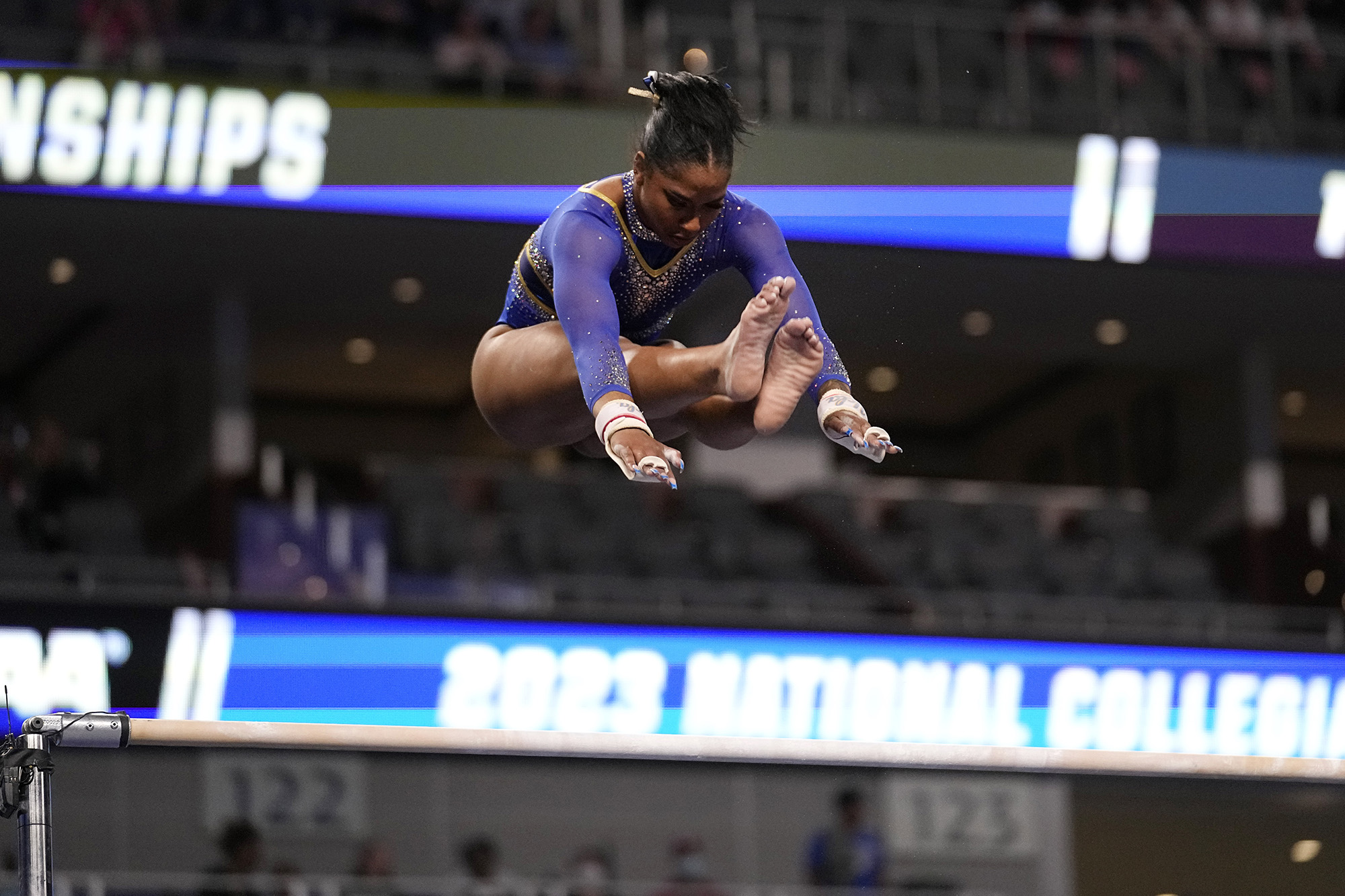 UCLA's Jordan Chiles competes on the uneven parallel bars during the semifinals of the NCAA women's gymnastics championships, Thursday, April 13, 2023, in Fort Worth, Texas.