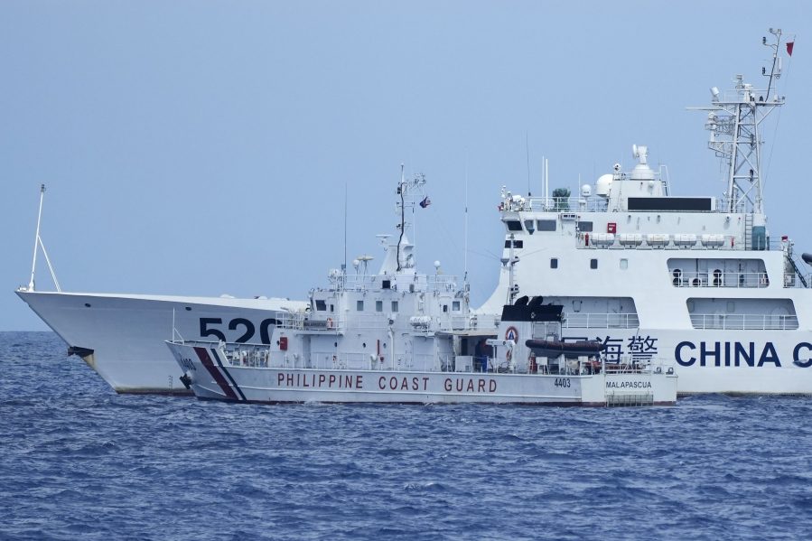 A Chinese coast guard ship blocks the Philippine patrol vessel BRP Malapascua as it maneuvers to enter the mouth of Second Thomas Shoal on April 23 in the South China Sea.
