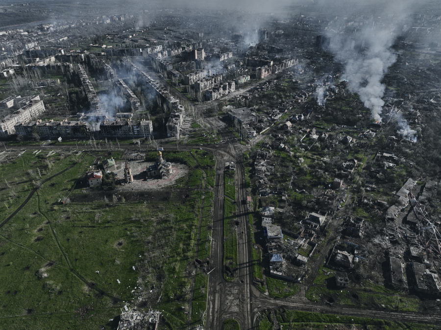 Smoke rises from buildings in this aerial view of Bakhmut, the site of the heaviest battles with the Russian troops in the Donetsk region, Ukraine, Wednesday, April 26, 2023.