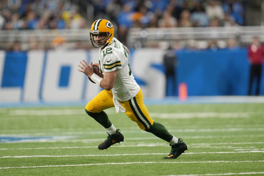 FILE - Green Bay Packers quarterback Aaron Rodgers scrambles during the first half of an NFL football game against the Detroit Lions, Nov. 6, 2022, in Detroit. Rodgers is leaving behind his brilliant legacy in Green Bay and heading to the bright lights -- and massive expectations -- of the Big Apple. The New York Jets agreed on a deal Monday, April 24, 2023, to acquire the four-time NFL MVP from the Packers, according to a person with knowledge of the trade. The person spoke to The Associated Press on the condition of anonymity because the teams have not officially announced the deal.