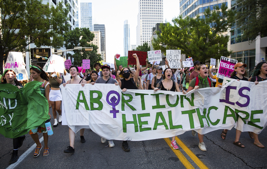 FILE - Abortion-rights protesters march down Congress Avenue in downtown Austin, Texas following the Supreme Court decision to overturn Roe v. Wade, Friday, June 24, 2022. Some Democrat-controlled states are advancing and adopting laws and executive orders intended to shield their residents against civil lawsuits and criminal investigations related to providing abortions for women from states where there are bans.