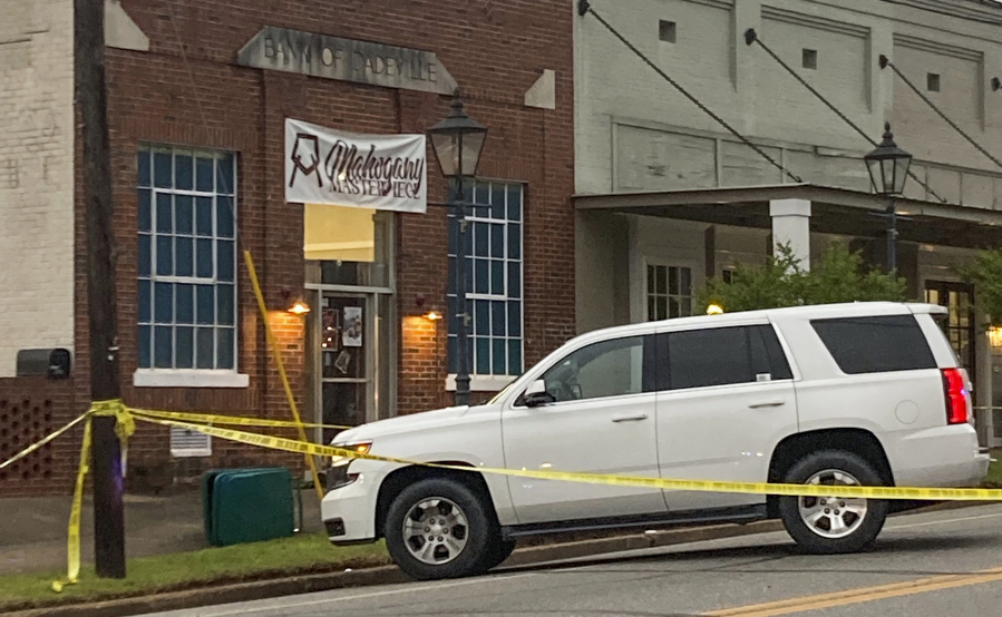 Investigators work at the site of a fatal shooting in downtown Dadeville, Ala., on Sunday, April 16, 2023. Several were killed during a shooting at a birthday party Saturday night, the Alabama Law Enforcement Agency said.