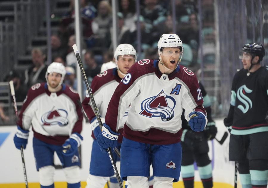 Colorado Avalanche center Nathan MacKinnon (29) reacts after scoring against the Seattle Kraken during the first period of Game 3 of an NHL hockey Stanley Cup first-round playoff series Saturday, April 22, 2023, in Seattle.