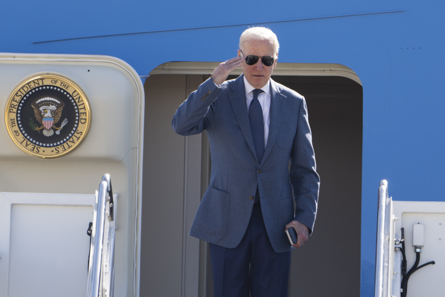 President Joe Biden salutes as he boards Air Force One at Andrews Air Force Base, Md., Tuesday, April 11,2023. Biden is visiting Ireland and neighboring Northern Ireland to mark the 25th anniversary of the Good Friday Agreement, confer with top officials on current issues and honor his Irish ancestors.