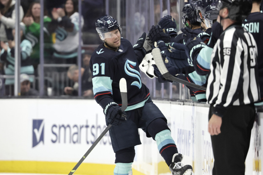 Seattle Kraken's Daniel Sprong (91) celebrates his goal against the Chicago Blackhawks during the second period of an NHL hockey game Saturday, April 8, 2023, in Seattle.