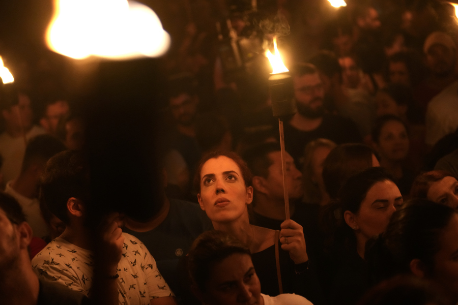 People carrying torches take part in the Procissao do Fogareu or torch Procession, during a Holy Week in Goias, 350 km (217 miles) west of Brasilia, Brazil, early Thursday, April 6, 2023. The procession is a reenactment of the moment of Christ's arrest at the Olive Garden by featuring hooded penitents in lieu of Roman soldiers.