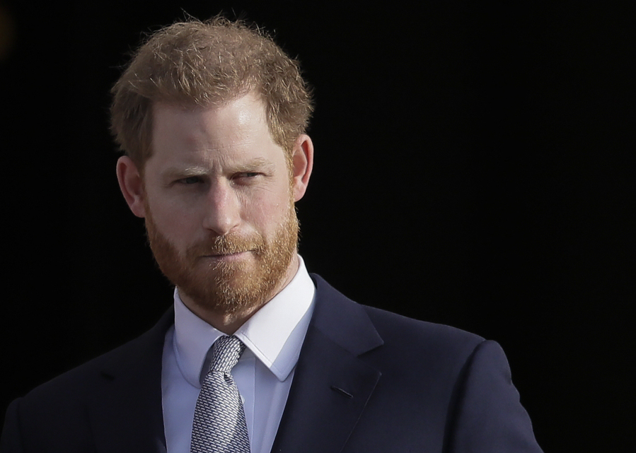 FILE - Britain's Prince Harry arrives in the gardens of Buckingham Palace in London, Jan 16, 2020. Buckingham Palace says Prince Harry will attend the Coronation service of his father, King Charles III, at Westminster Abbey on May 6, setting aside months of speculation about his presence.