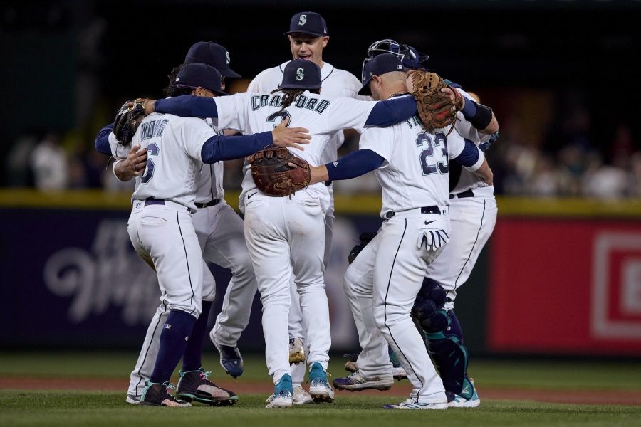 Seattle Mariners dance after the team's 5-4 win over the St. Louis Cardinals in a baseball game Saturday, April 22, 2023, in Seattle.