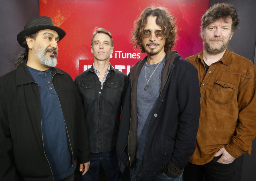 FILE - Members of Soundgarden, from left, Kim Thayil, Matt Cameron, Chris Cornell and Ben Shepherd appear at the iTunes Festival showcase during the SXSW Music Festival in Austin, Texas on March 13, 2014. The widow of singer Cornell and his former bandmates in Soundgarden said Monday that they have resolved her lawsuit against them, clearing the way for the release of the band's final recordings more than five years after his death.