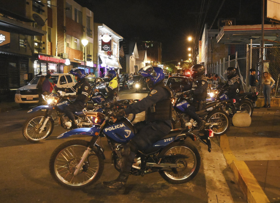 FILE - Police officers patrol in the nightclubs and bar zone of San Jose, Costa Rica, Jan 27, 2023. According to authorities, the Central American nation has reached its highest murder rate since the Organization of Judicial Investigation office has kept records.
