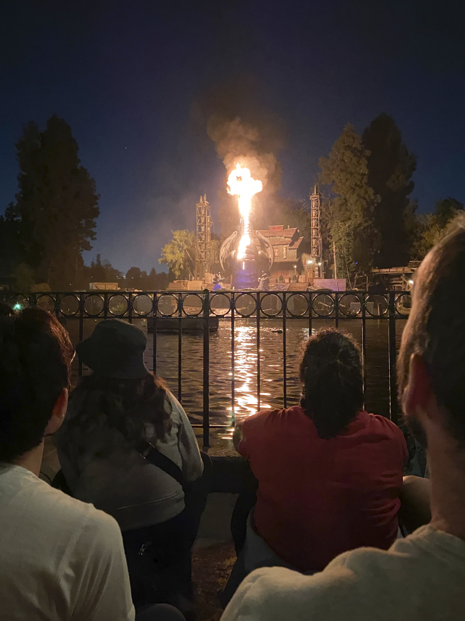This photo courtesy of Shawna Bell shows a fire during the "Fantasmic" show in the Tom Sawyer Island section of Disneyland resort in Anaheim, Calif., on Saturday, April 22, 2023.