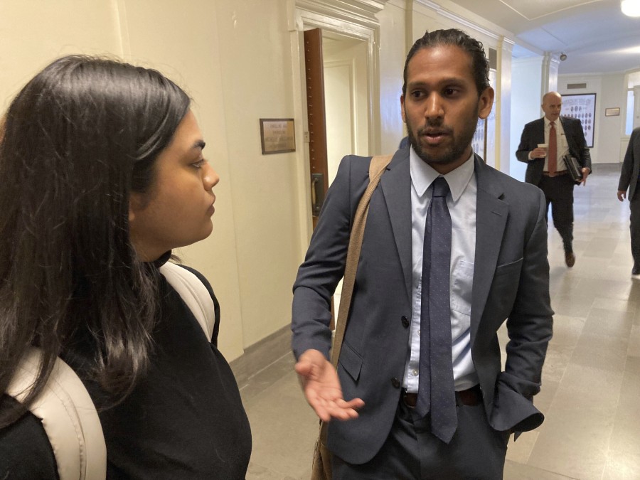 Jay Devineni, right, a student at the University of Missouri School of Medicine, talks with fellow medical school student Supriya Vuda in the hallway of the Missouri Capitol in Jefferson City, Mo., on March 28, 2023. Devineni and Vuda testified against legislation in a Senate committee that would restrict diversity, equity and inclusion initiatives in medical schools and among health care providers. (AP Photo/David A.