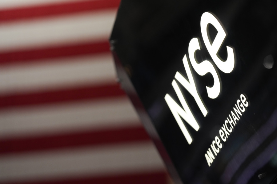 FILE - An NYSE sign is seen on the floor at the New York Stock Exchange in New York, Wednesday, Feb. 22, 2023.