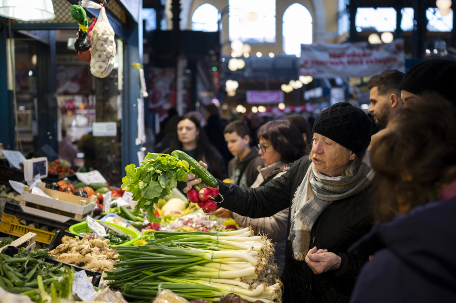 Customers purchase food in Budapest's Grand Market Hall on Saturday, April 8, 2023. In Hungary, people are increasingly unable to cope with the biggest spike in food prices in the EU, reaching 45% in March.