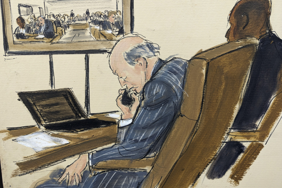 This artist sketch depicts Fox News attorney Daniel Webb talking on a cell phone in Delaware Superior Court Tuesday afternoon, April 18, 2023, in Wilmington, Del., as the attorneys waited in the courtroom to give opening statements. Soon after, Judge Eric Davis announced Fox News and Dominion Voting Systems had reached a settlement in the voting machine company's defamation lawsuit.