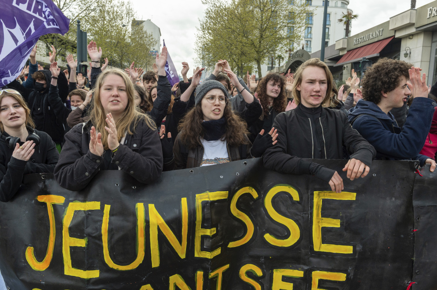 Students march during a demonstration Thursday, April 13, 2023 in Rennes, western France. Protesters opposed to President Emmanuel Macron's unpopular plan to raise the retirement age in France marched Thursday in cities and towns around France in a final show of anger before a decision on whether the measure meets constitutional standards.