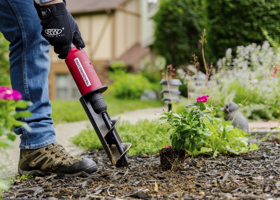 This image provided by Rotoshovel shows a gardener digging a hole with the handheld power digger, one of many available tools designed to make gardening easier.