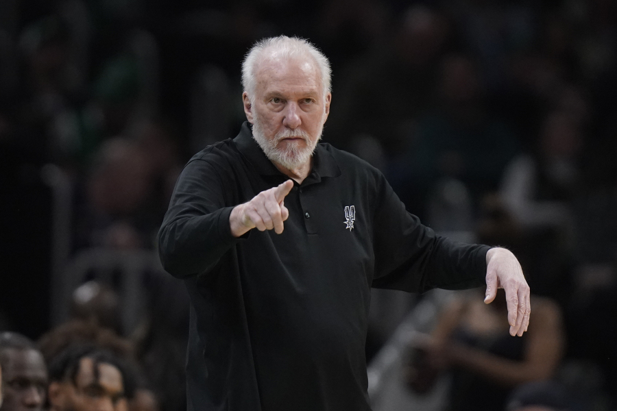 FILE - San Antonio Spurs head coach Gregg Popovich points from the bench in the second half of an NBA basketball game against the Boston Celtics, Sunday, March 26, 2023, in Boston. The Naismith Memorial Basketball Hall of Fame made it all official on Saturday, April 1, 2023 with three of the NBA's all-time international greats -- Dirk Nowitzki, Tony Parker and Pau Gasol -- joining Dwyane Wade, Becky Hammon and  Popovich as the headliners of the 2023 class that will be enshrined on Aug.