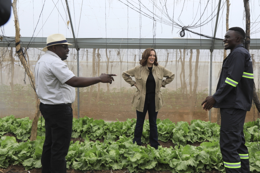 U.S. Vice President Kamala Harris visits Panuka farms outside Lusaka, Zambia, Saturday April 1, 2023. At left is Bruno Mweemba, the farm's founder. Harris is on the last leg of a a seven-day African visit that took her to Ghana and Tanzania.