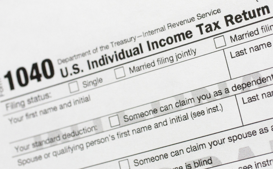 FILE - A portion of the 1040 U.S. Individual Income Tax Return form is shown July 24, 2018, in New York. The IRS has been tasked with looking into how to create a government-operated electronic free-file tax return system for all. Congress has directed the IRS to report in on how such a system might work.
