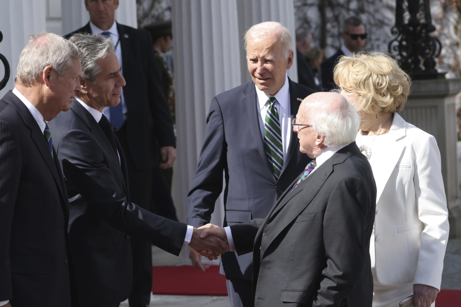 President Joe Biden introduces Irish President Michael D. Higgins, centre, to U.S. Secretary of State Anthony Blinken, second left, as he pays an official visit in Dublin, Ireland, Thursday, April 13, 2023. President Biden is three day visit to Ireland.