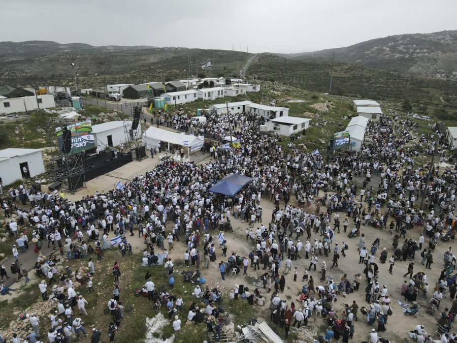 Israeli, most of the settlers gather in the outpost of Eviatar in the West Bank, Monday, April 10, 2023. Thousands led by hardline ultranationalist Jewish settlers marched to the unauthorized settlement outpost Eviatar in the northern West Bank that was cleared by the Israeli government in 2021, protected by a large contingent of Israeli soldiers and police.