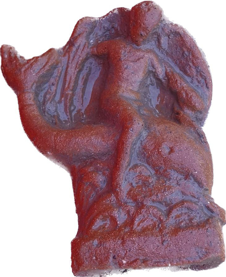 This undated photo shows a terracotta figurine of Eros riding a dolphin found in a newly discovered sanctuary, which dates from the 5th century B.C., that was first identified in 2019 along the ancient city walls of Paestum, Southern Italy. The excavations of the sanctuary in the ancient city of Paestum have unearthed seven terracotta bull heads and a figurine of Eros riding a dolphin that shines new light on the religious life and rituals of the ancient Greek city, culture ministry officials said Saturday, April 15, 2023.