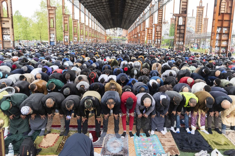 Faithful attend the final prayer of Eid al-Fitr, marking the end of Ramadan, at the Dora Park in Turin, Italy, Friday, April 21, 2023.