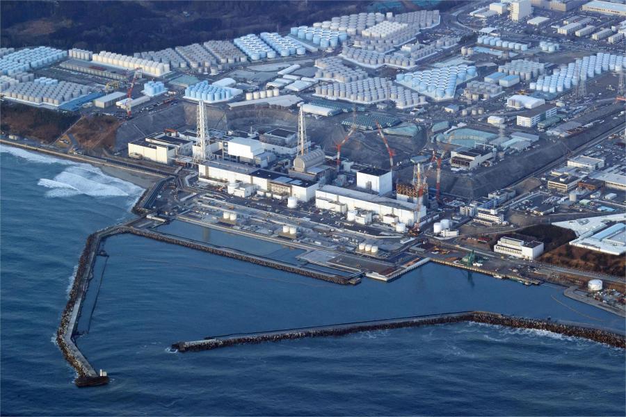 FILE - This aerial photo shows the Fukushima Daiichi nuclear power plant in Okuma town, Fukushima prefecture, north of Tokyo, on March 17, 2022. Images captured by a robotic probe inside one of the three melted reactors at the tsunami-wrecked Fukushima nuclear power plant were revealed at a news conference at the plant's operator, Tokyo Electric Power Company Holdings, Tuesday, April 4, 2023, showing exposed steel bars in the main supporting structure and its thick external concrete wall largely missing near its bottom, triggering concerns about its earthquake resistance in case of another major disaster.