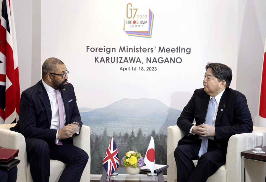 British Foreign Secretary James Cleverly, left, and Japanese Foreign Minister Yoshimasa Hayashi talk during their bilateral meeting, on the sidelines of G7 Foreign Ministers' meeting in Karuizawa, Japan, Monday, April 17, 2023.(Kyodo News via AP)