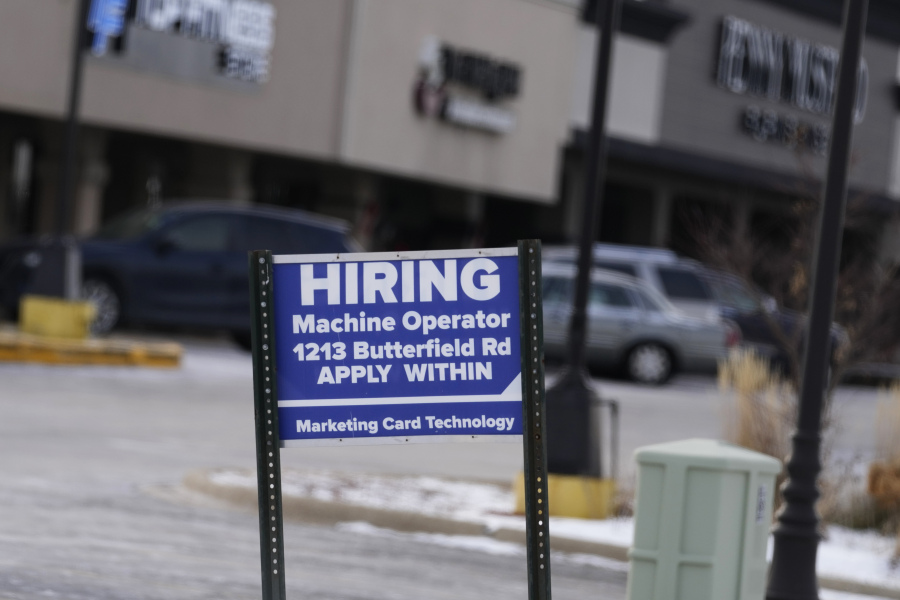 File - A hiring sign is seen in Downers Grove, Ill., Thursday, May 5, 2022. On Tuesday, the Labor Department reports on job openings and labor turnover for February.(AP Photo/Nam Y.