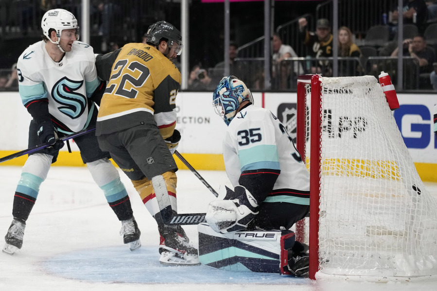 Vegas Golden Knights right wing Michael Amadio (22) scores on Seattle Kraken goaltender Joey Daccord (35) during the second period of an NHL hockey game Tuesday, April 11, 2023, in Las Vegas.