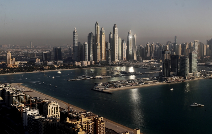 FILE - Luxury towers dominate the skyline in the Marina district, center, and the new Dubai Harbour development, right, are seen from the observation deck of "The View at The Palm Jumeirah" in Dubai, United Arab Emirates, April 6, 2021. The head of Russia's Foreign Intelligence Service, Sergey Naryshkin, held extensive meetings with United Arab Emirates leaders in Dubai in 2020. A U.S. official separately has told the AP that the United States also was worried about Russian money coming into Dubai's red-hot real estate market.