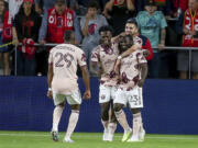 Portland Timbers' Yimmi Chara (23) is congratulated for his goal against St. Louis City during the second half of an MLS soccer match Saturday, April 29, 2023, in St. Louis.
