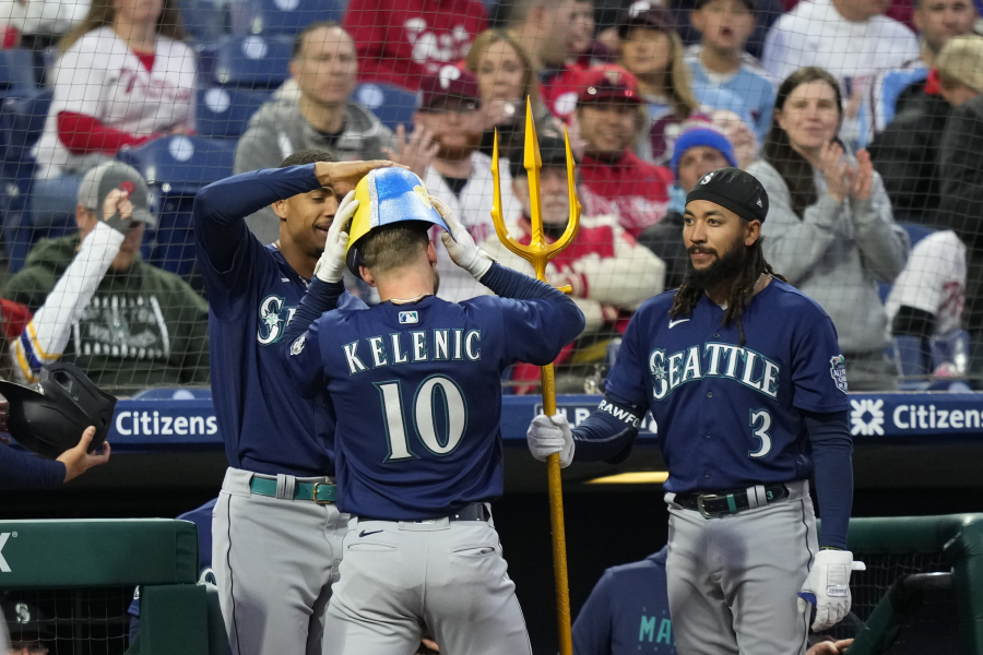 Seattle Mariners' Jarred Kelenic, center, celebrates with Julio Rodriguez, left, and J.P. Crawford, after his home run in the fifth inning against the Philadelphia Phillies on Tuesday in Philadelphia.