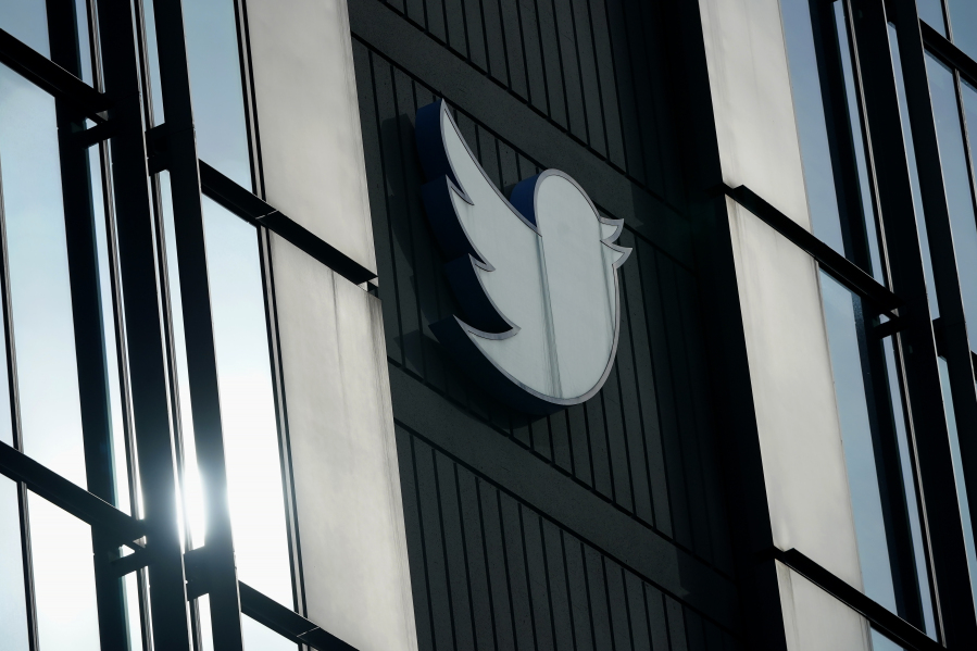 FILE - A Twitter logo hangs outside the company's offices in San Francisco, on Dec. 19, 2022. Twitter has labeled National Public Radio (NPR) as "state-affiliated media" on the social media site Wednesday, April 5, 2023, a move some worried could undermine public confidence in the news organization.