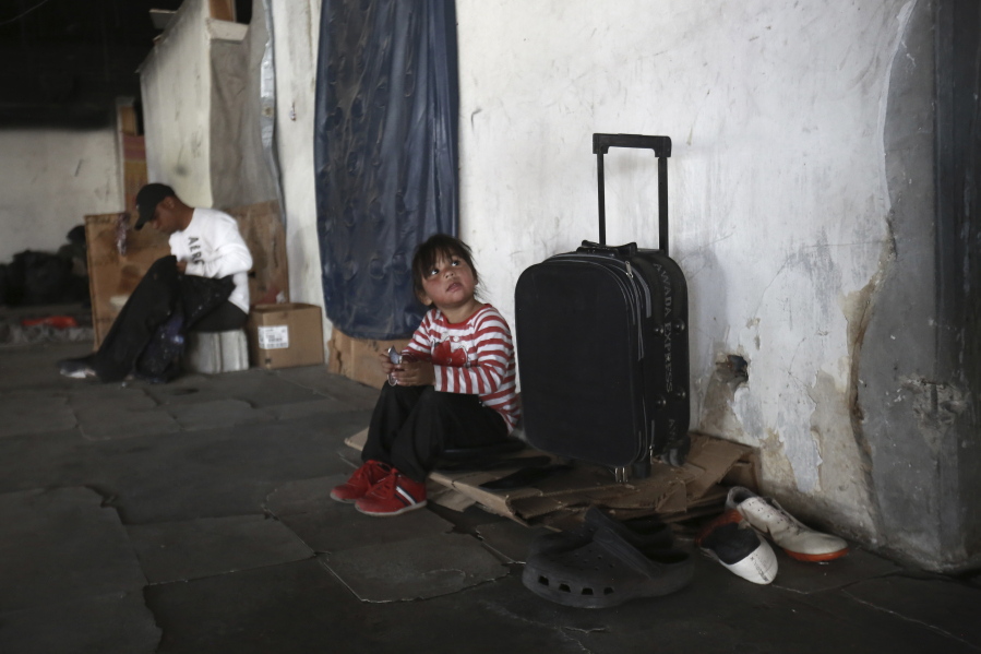 Venezuelan migrants stay in an abandoned building in Ciudad Juarez, Mexico, Thursday, March 30, 2023, days after a fire that killed dozens at an immigration detention center.