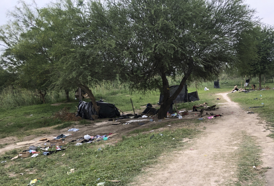 Makeshift tents and debris are seen at a migrant camp in Matamoros, Mexico, Friday, April 21, 2023. About two dozen makeshift tents in the area were set ablaze and destroyed, across the border from Texas this week, witnesses said.