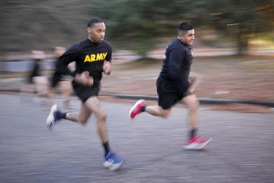 Army Staff Sgt. Daniel Murillo, right, runs up hill as part of his physical training at Ft. Bragg on Wednesday, Jan. 18, 2023, in Fayetteville, N.C. Obesity in the U.S. military surged during the pandemic, new research shows. Nearly 10,000 active duty Army soldiers became newly obese between February 2019 and June 2021, after restricted duty and limited exercise led to higher body mass scores.