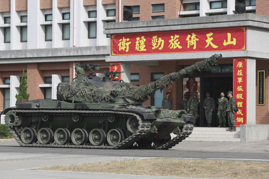 FILE - A tank is deployed during a preparedness enhancement drill simulating the defense against Beijing's military intrusions, ahead of the Lunar New Year in Kaohsiung City, Taiwan on Wednesday, Jan 11, 2023.