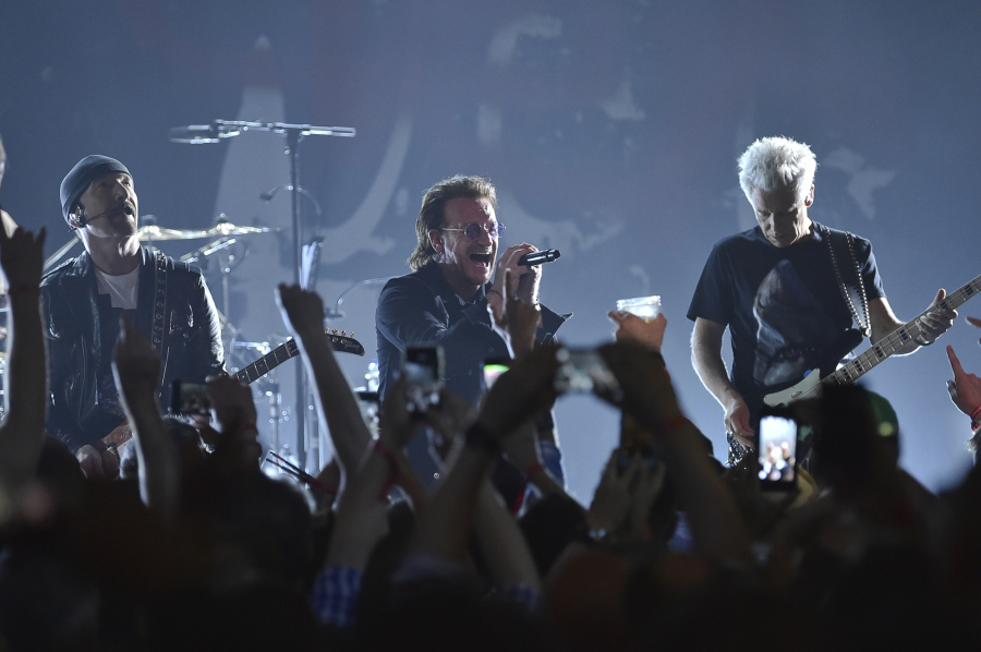 The Edge, from left, Bono and Adam Clayton of U2 perform during a concert at the Apollo Theater on June 11, 2018, in New York.