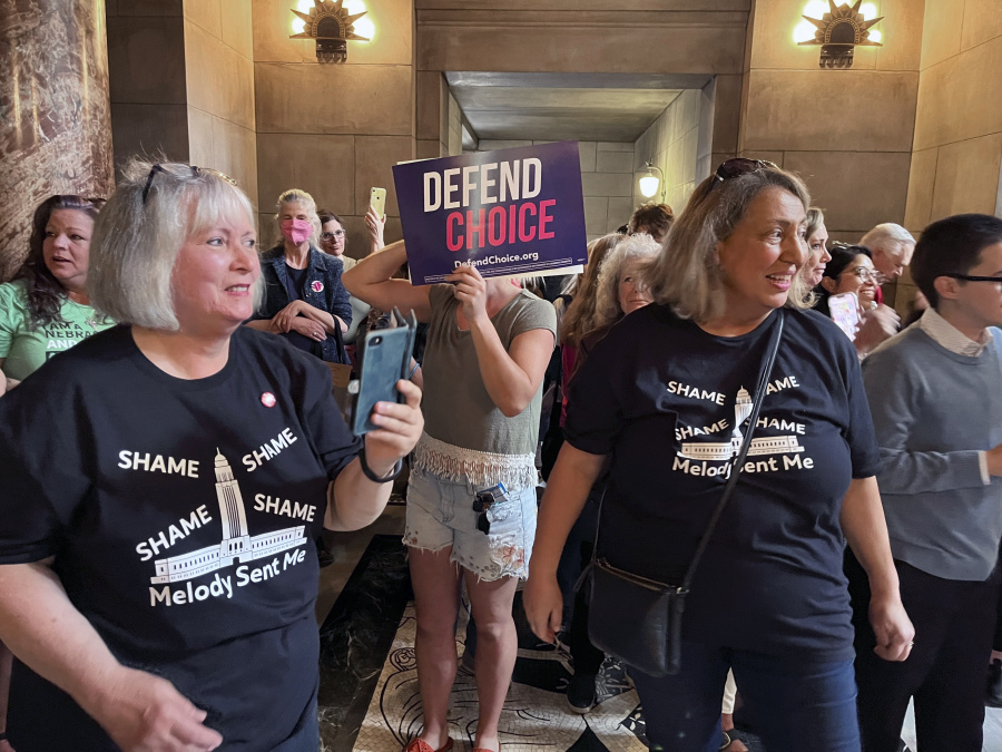 Pat Neal, left, and Ann Fintell, both of Lincoln, celebrate in the Nebraska Capitol rotunda after the failure of a bill that would have banned abortion around the sixth week of pregnancy, Thursday, April 27, 2023 in Lincoln, Neb. The bill is now likely dead for the year, leaving in place a 2010 law that bans abortions at 20 weeks.
