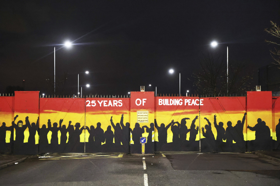 A mural on the peace gates at Lanark Way celebrates the Good Friday Agreement, in west Belfast, Wednesday, April 5, 2023. It has been 25 years since the agreement largely ended a conflict in Northern Ireland that left 3,600 people dead.